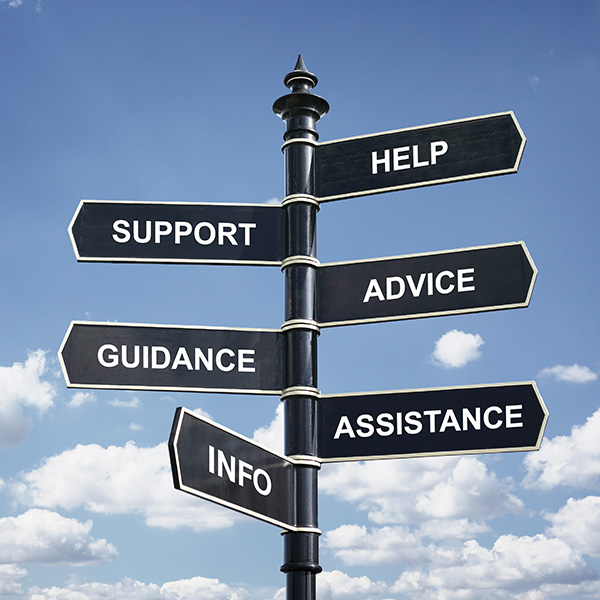 A sign post with signs pointing in different directions. Text on signs says things like Help, Support, Advice, Info, and so on.